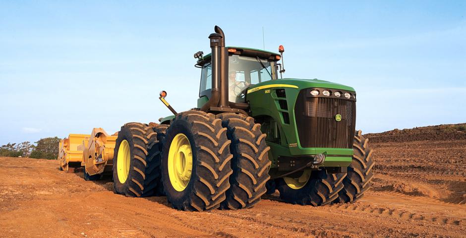 John Deere Tractor pulling a scraper