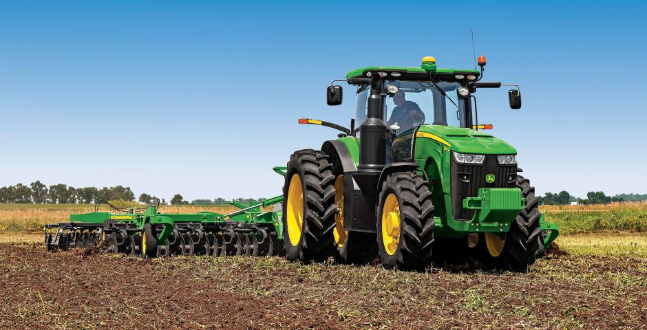 John Deere Tractor pulling a disc